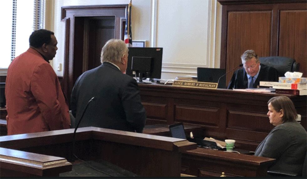 Cincinnati City Councilman Wendell  Young (left) and his lawyer, Scott Croswell (right) face...