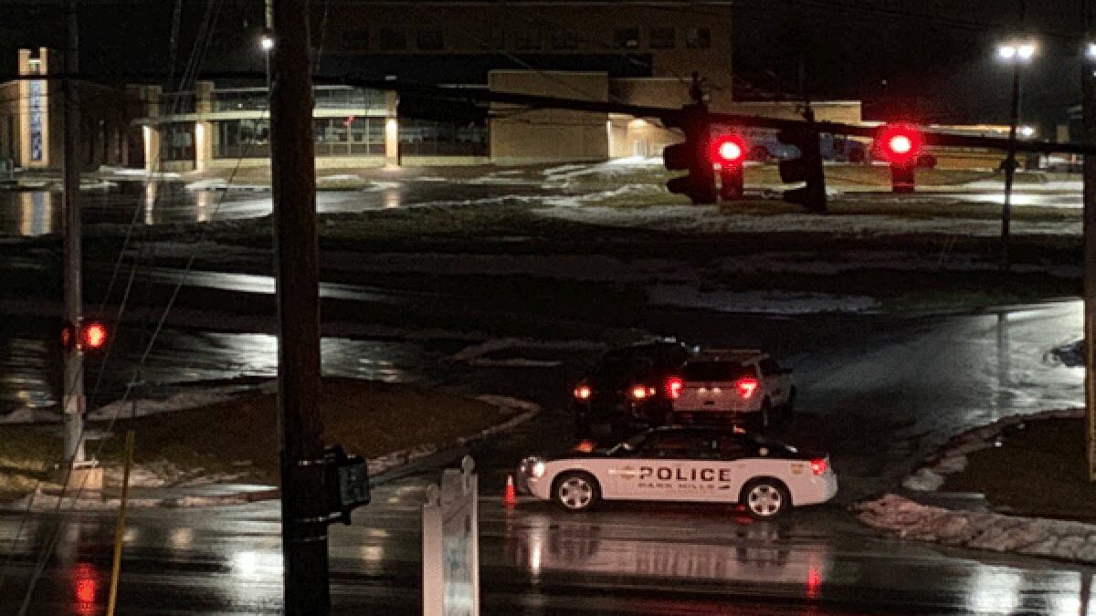 Police vehicles are parked around Covington Catholic High School in Park Hills, Kentucky...