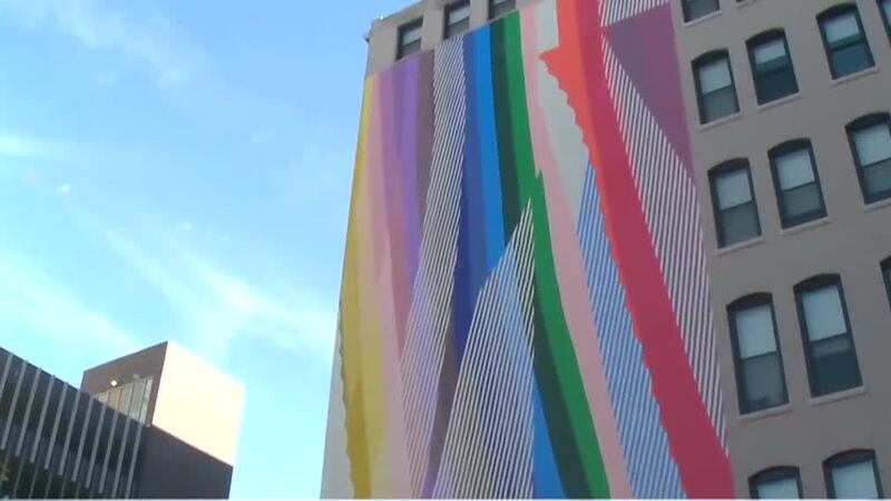 Famous mural artist finishes new art piece in Cincinnati