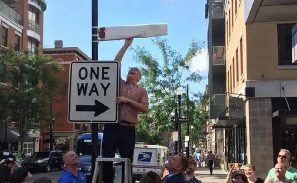 Jim Obergefell takes the cover off a street sign named after him and his late husband....