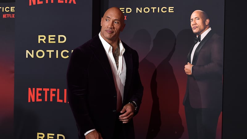Cast member Dwayne Johnson arrives at the Los Angeles premiere of "Red Notice" at L.A. Live on...