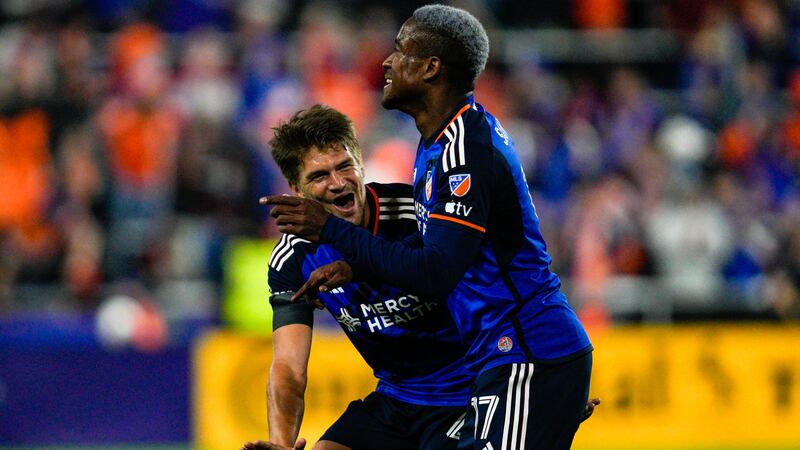 Cincinnati's Sergio Santos, right, celebrates with Nick Hagglund (4) after scoring a goal...