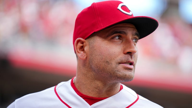 Cincinnati Reds' Joey Votto stands on the field after a baseball game against the Pittsburgh...
