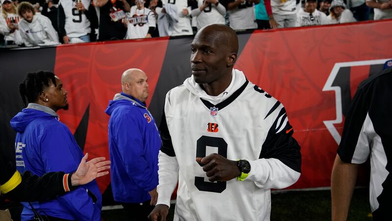 Former Cincinnati Bengals' Chad "Ochocinco" Johnson watches before an NFL football between the...