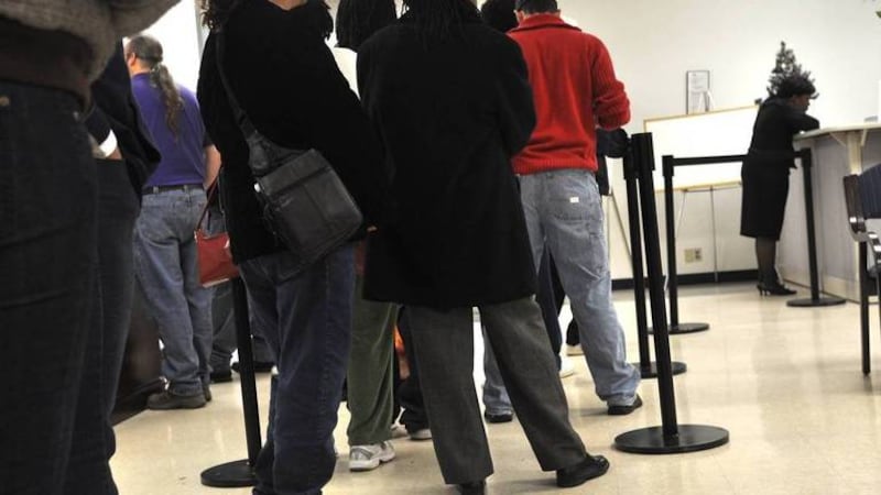 People line up at the N.C. Employment Security Commission office. Data released by the N.C....