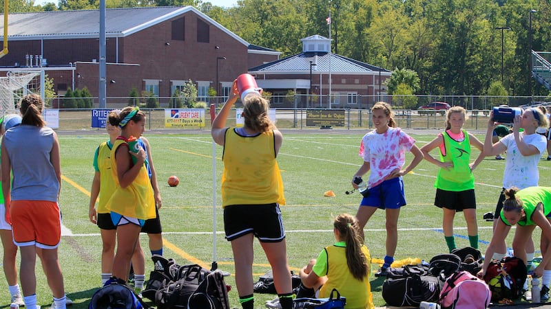 FILE - Members of the Little Miami High School soccer team take a break during practice, in...