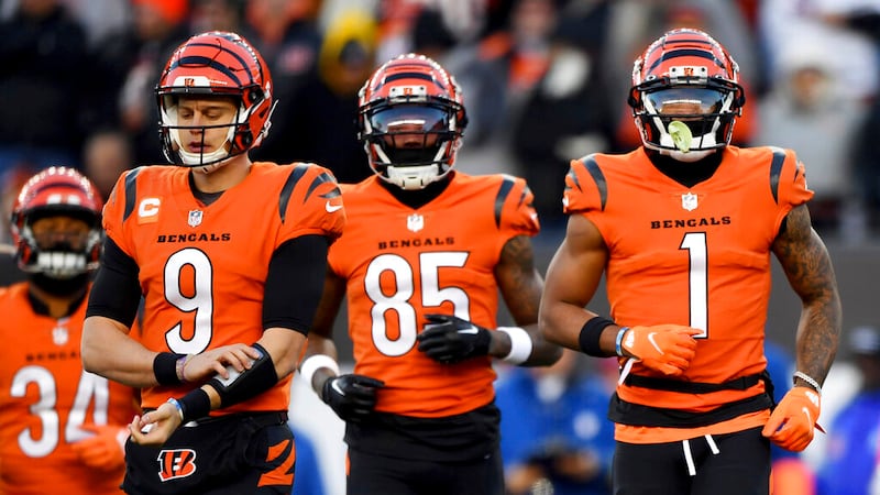 FILE - Cincinnati Bengals quarterback Joe Burrow (9), wide receiver Tee Higgins (85) and...