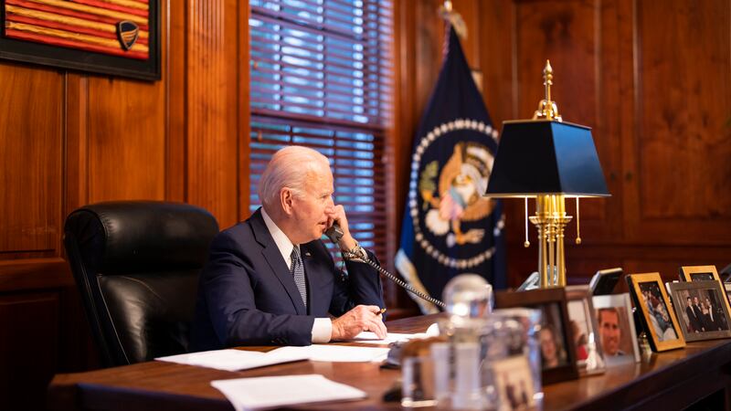 In this image provided by The White House, President Joe Biden speaks with Russian President...