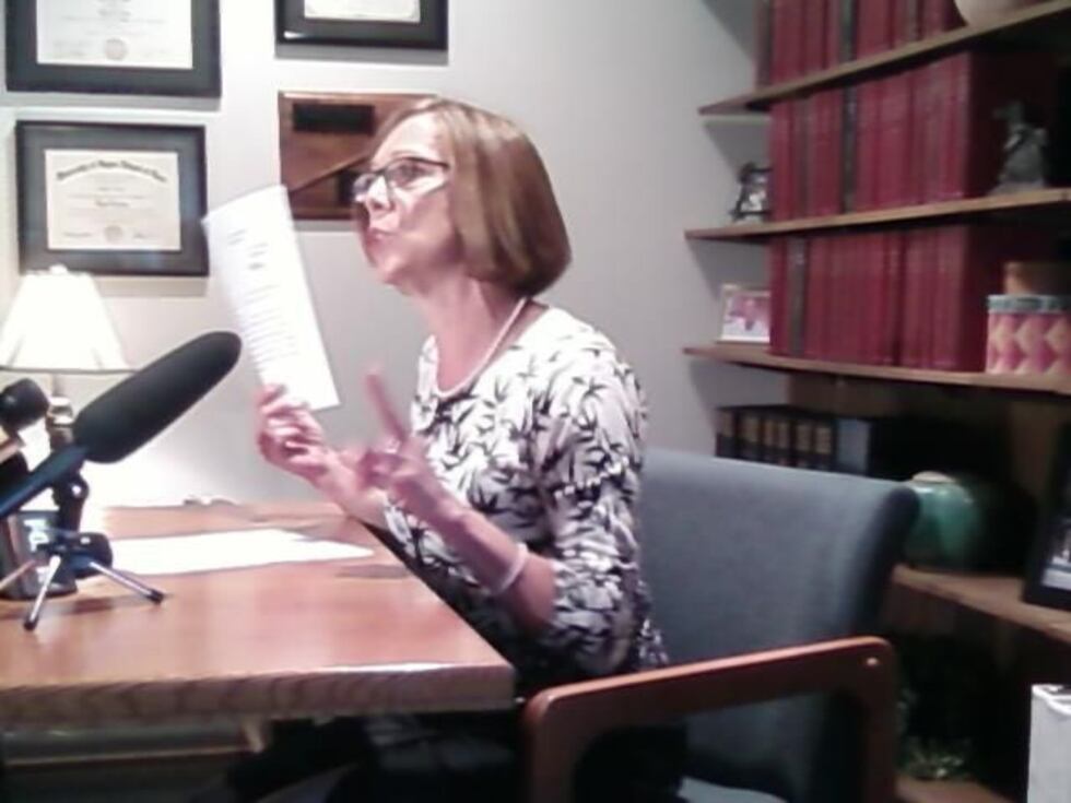 Prosecutor Rachel Hutzel talks to the media