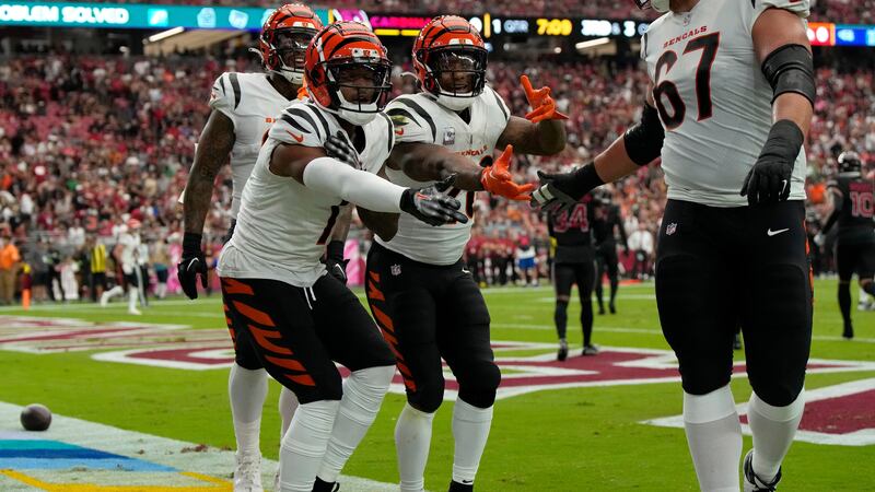 Cincinnati Bengals wide receiver Ja'Marr Chase, left, celebrates his touchdown against the...