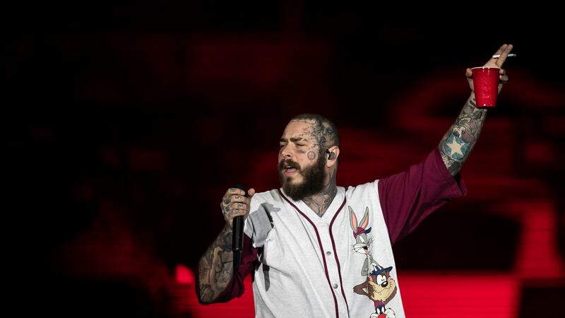 FILE - American rapper Post Malone performs during the Rock in Rio music festival in Rio de...