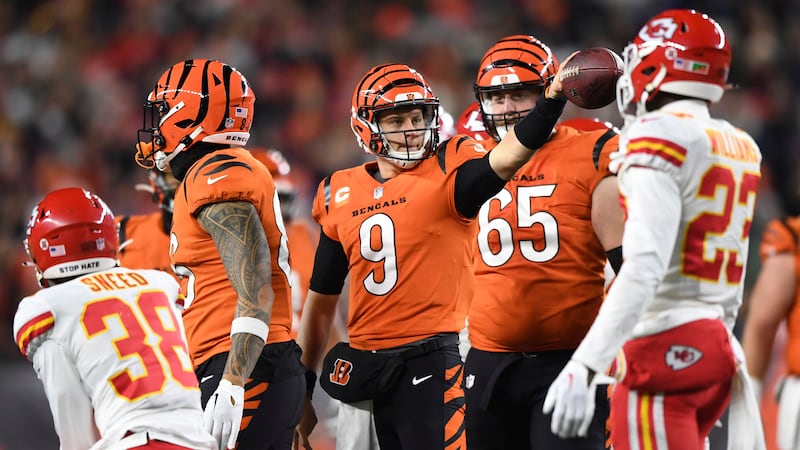 Cincinnati Bengals quarterback Joe Burrow (9) celebrates after carrying the ball during an NFL...