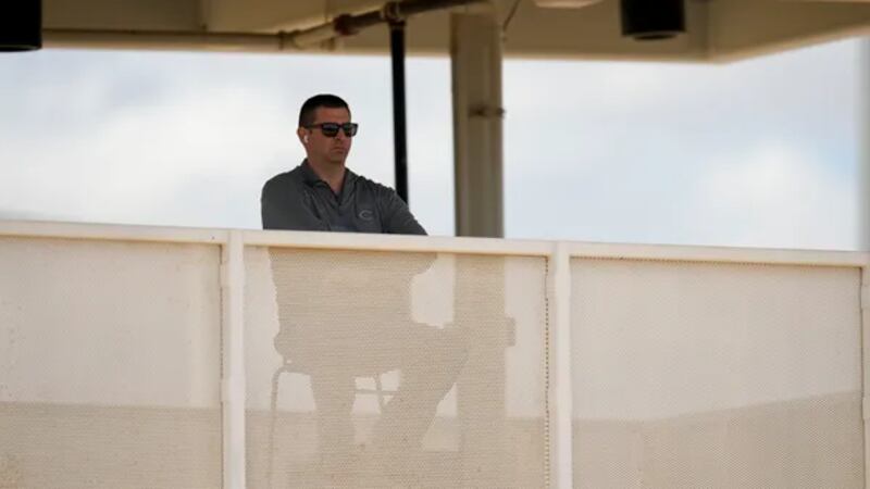 Nick Krall watches spring training workouts in February 2023.