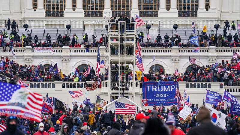 FILE - Insurrectionists loyal to President Donald Trump breach the Capitol in Washington, Jan....