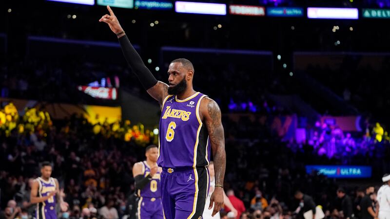 Los Angeles Lakers forward LeBron James acknowledges the crowd during the first half of an NBA...