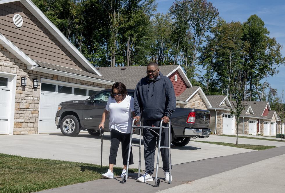 Patricia Upshaw looks to David Upshaw as he takes a small break during a walk in their Copley...