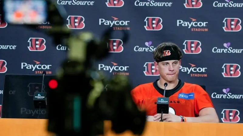 Cincinnati Bengals quarterback Joe Burrow listens to a question from the media Wednesday,...